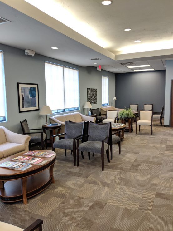 Interior of Cole White Dental waiting room with seating for patients in Fayetteville, AR